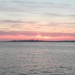 View across from Roscoff to the sunset over the island of Lle-de-Batz