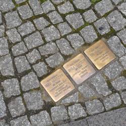 brass markers outside buildings