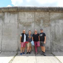 standing against a remnant of the wall