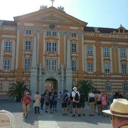 Walk through archway into Abby courtyard