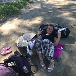 Hope chilling at the beach during the wait for our next flight