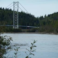 The Alaska Pipeline is suspended over the Tanana River.