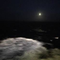 the moon over the North Sea, with 10-12 foot seas