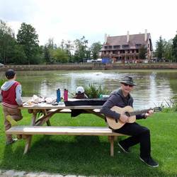 The busker forgot to put out his hat!