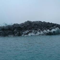The black in the blue glacial ice is volcanic ash
