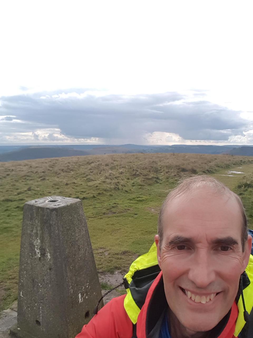 Twmbarlan trig point. Cardiff in background