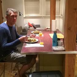 Neil, dinner and the lounge-room.