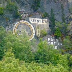 In the days before billboards advertising was paianted up on the cliff walls behid the town.