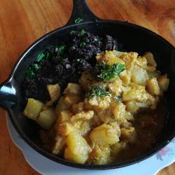 Cau cau (traditional "criollo" tripes & potatoes in Aji sauce) con sancrecita (black pudding)