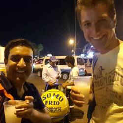Drinking chicha at the bus stop