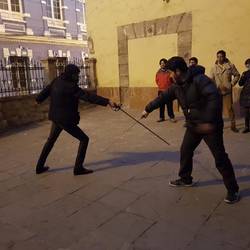 Teaching sword fighting at the base of Tower of Jesus