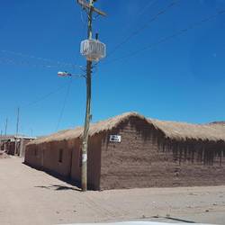 Mud brick walls and thatched roofs
