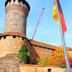 German flag, castle tower and crane - Nuremberg