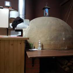 Earthen oven fired by wood