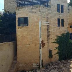 A picture showing an unearthed old street at the level it would have been 550-1000BC.