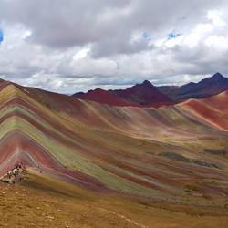 Rainbow Mountain and red valley to the right