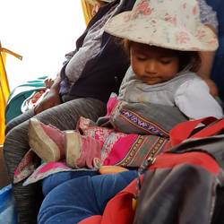 A cute little kid sitting next to me in the bus