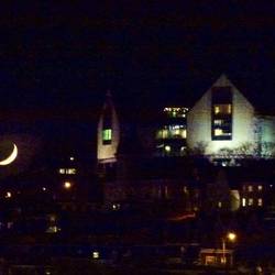 Night view of The Rooms and the rising moon from our apartment.