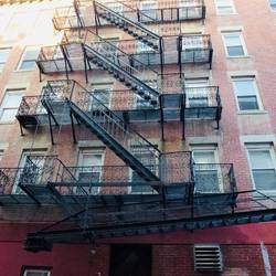 Building at the end of our street. The fire escapes are very typical of most in the area.