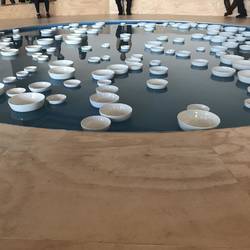 Contemplative pool - a pool with crockery floating around