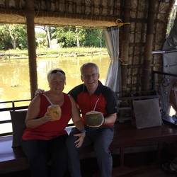 Drinking fresh coconut on canal cruise