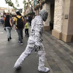 Zombie about to frighten the crap out of an unsusepting women!