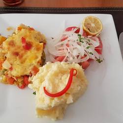 Egg tortilla, potato puree and salad