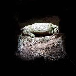 The horizontal hole at the bottom of the vertical hole, from inside the top chamber