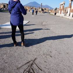 Guide's drawing of how the four columns of Temple of Apollo line up perfectly with Mount vesuvius