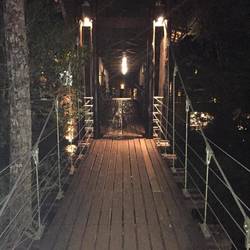 Suspension bridge to building with our room