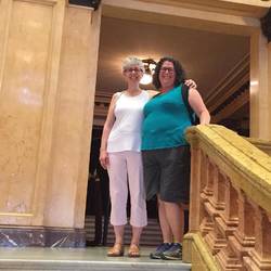 Top of stairs in main entry to theater