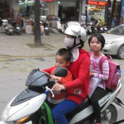 Family scooter, with child in front and back of parent