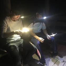 Thui and Wath examining the frog skewers