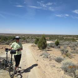 A fairly smooth stretch of the road but too steep to bike. Note pueblo in far background.