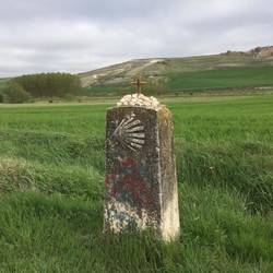 In the middle of nowhere...placed by a pilgrim I would guess.
