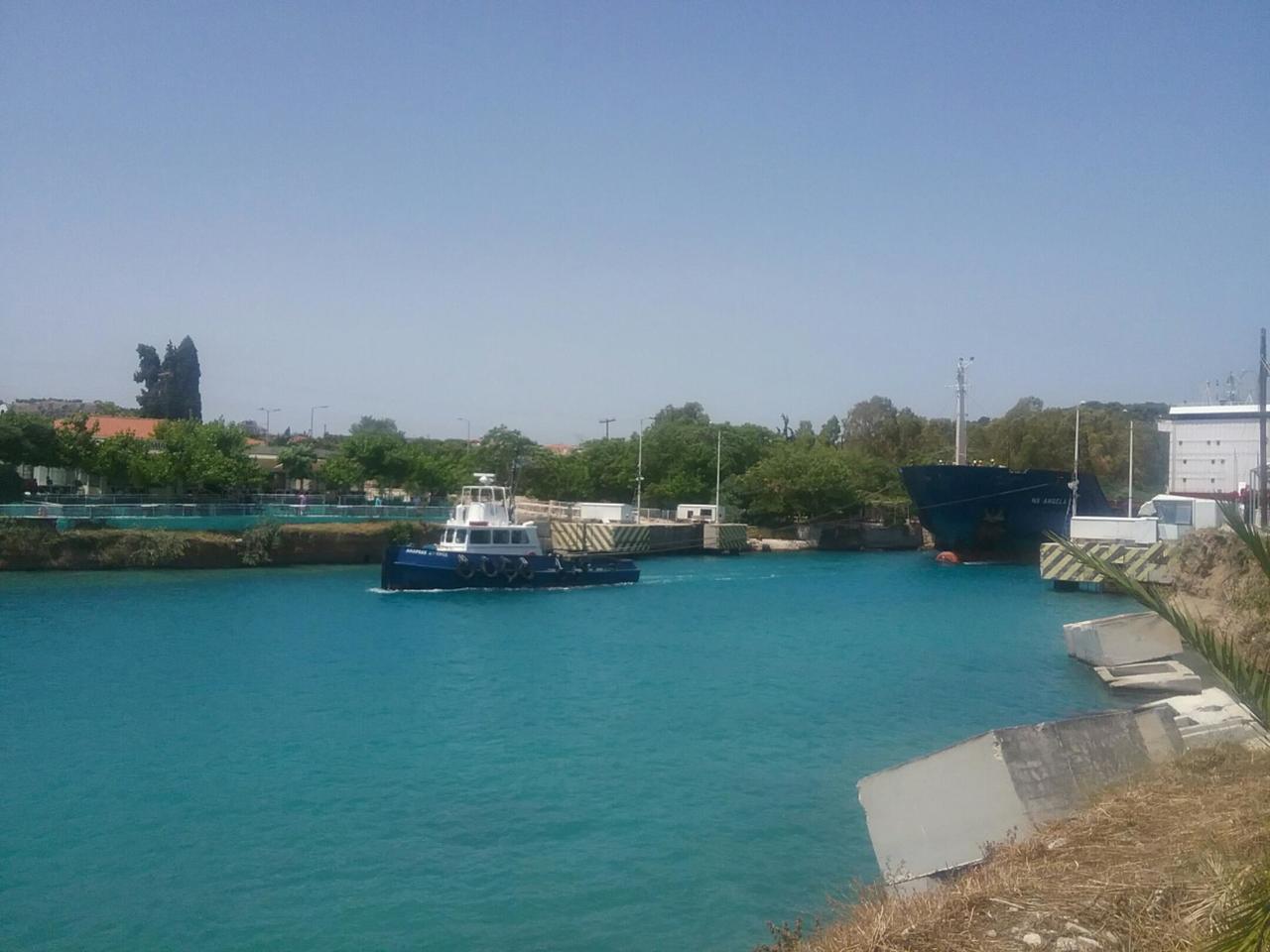 Boat being towed out of canal
