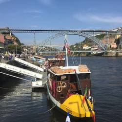 On the river walk with the famous bridge in the background.