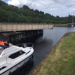 The swing bridge is open to allow the boat to enter the lock system
