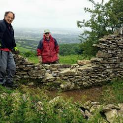 Volunteers repairing the wall
