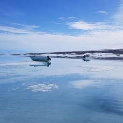 Boats sitting on the ice--bizarre