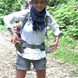 Lara loading her pockets with rocks ready for the next windy day - thanks for the tip Elise