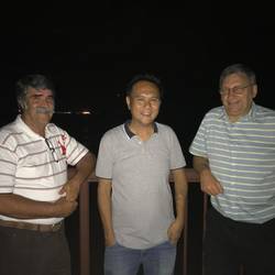 Some of the family watching a procession of planes appearing on the night sky, flying over our heads just befo