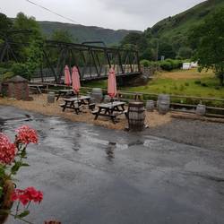 Towy Bridge from Towy Bridge Inn veranda in heavy downpour