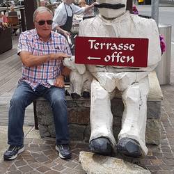 John sitting with a local