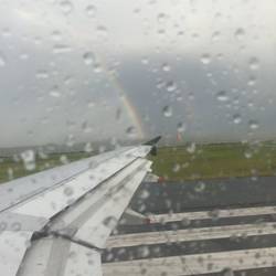 a little rain and a rainbow departing NZ