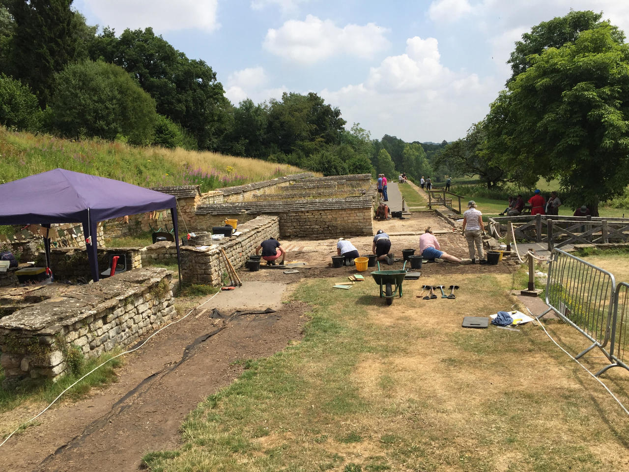 The archeology team uncovering mosaic tiles