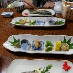 Local river fish along with soba noodle sushi, wasabi stems, a bit of chicken and wasp larvae