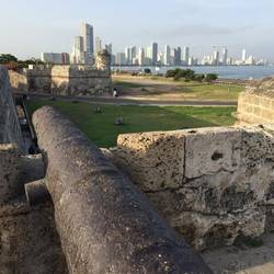 Original city walls with new construction in distance