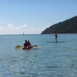Bonnie and Jason kayaking and Jen paddleboarding