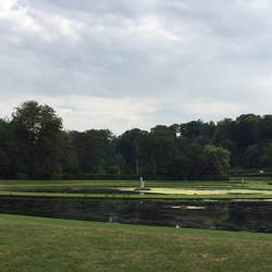 This area features a round pond, flanked by two crescent-shaped ponds, statues, and a viewing temple